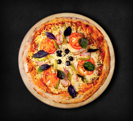 Pizza with ham on a black background. Visit my page. You will be able to find an image for every pizza sold in your cafe or restaurant.