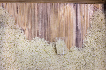 Top view of rice on wooden board