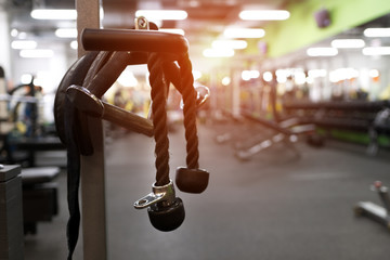 Fototapeta na wymiar Exercising machine in modern fitness center.