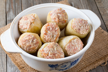 Frozen stuffed peppers in a saucepan
