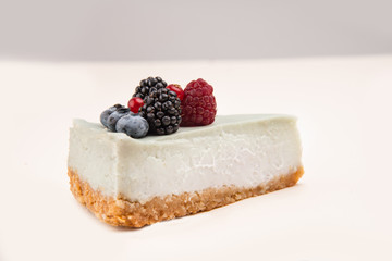 Blue cheesecake with different berries