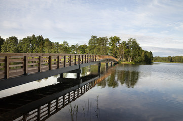 Fototapeta na wymiar View of lake and bridge.