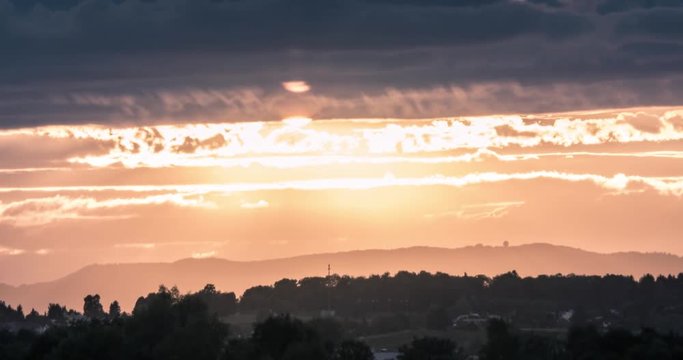 timelapse of a cloudy sunset with an amazing flash of sunlight