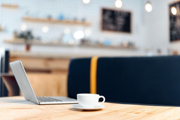 coffee cup and laptop