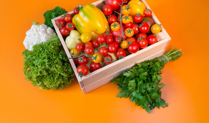 organic food background Vegetables in the basket on the kitchen table.