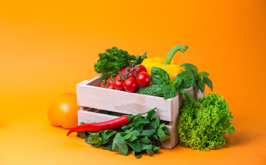 organic food background Vegetables in the basket on the kitchen table.