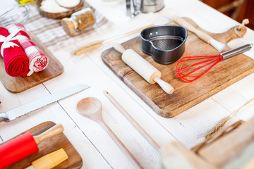 Bakery utensils. Kitchen tools for baking on a rustic wooden table.