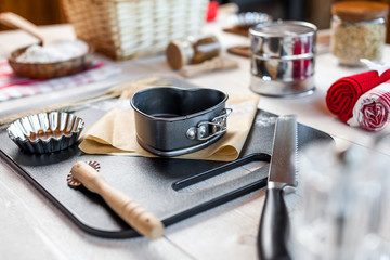 Fototapeta na wymiar Bakery utensils. Kitchen tools for baking on a rustic wooden table.