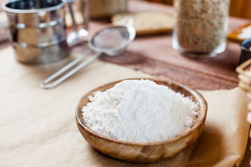 wheat and flour on rustic wooden table