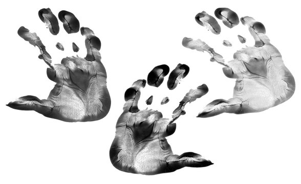 Kid hand prints black acrylic or ink set isolated on white background. fingerprint or stamp texture artwork of kids for education and journey. Top view. Black and white colors. Close up.