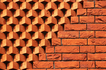 Sawtooth pattern brickwork. Decorative red brick wall as background