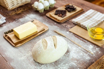 fresh dough on kitchen  rustic wooden table.