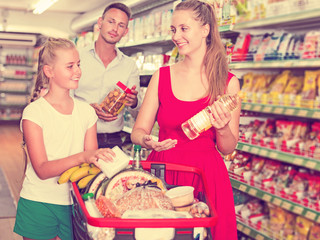 Family standing with purchases