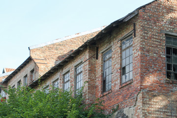 Fototapeta na wymiar Old brick house left abandoned in countryside.