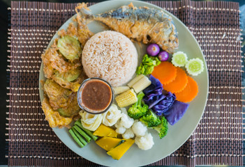 set rice Spicy Shrimp Paste and Chill Sauce Served with Mixed colorful  Vegetable in plate .(Nam Prik Ka Pi)