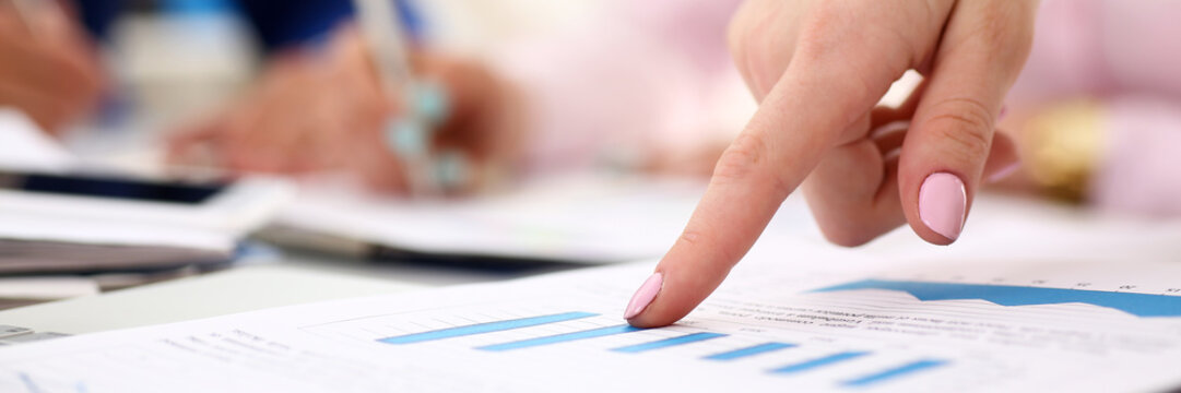 Female arm point pinger in financial graph