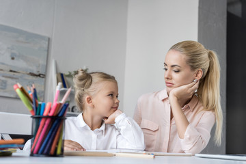 mother and daughter doing homework