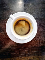 wonderful white cup of hot coffee on table