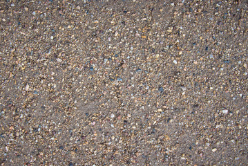 Sandy gravel background with many colors.