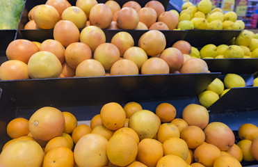 Fresh raw orange stacking for sale in supermarket