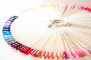 Fans of nail art polish tips samples isolated on white