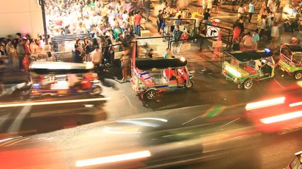 crowd of people walking with traffic jam at Siam center, Bangkok Thailand