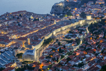 An aerial view of the ancient old town walls of Dubrovnik at sunset in Dalmatia, Croatia.