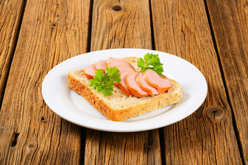 Whole wheat bread with sliced sausage