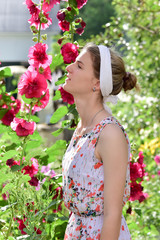 Fototapeta premium The collection of bouquet/ The girl in the garden tending the flowers