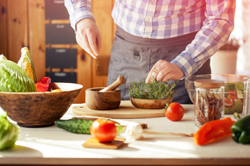 male cooking healthy salad