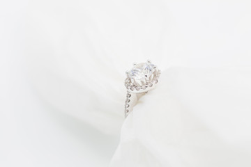 Diamond wedding rings on the white. selective focus