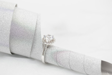 Diamond wedding rings on the white. selective focus