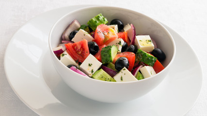 tomato, cucumber, red onion, and feta salad dressed with thyme olive oil mix