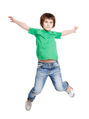 Happy laughing boy jumping on white isolated background