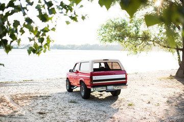 red car at riverside