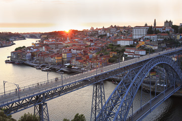 Porto skyline and Douro River at sunset with Dom Luis I Bridge on the foreground, Portugal