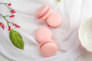 Pink strawberry macarons. French delicate dessert for Breakfast