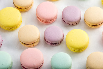 Colorful macarons on a white background. French dessert
