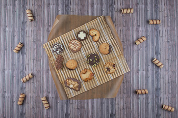 Dark vintage background with various homemade cookies.