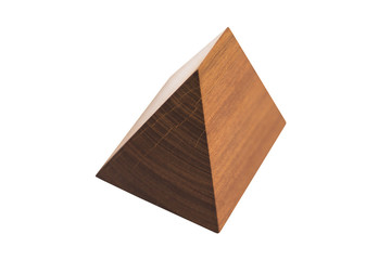 Small handmade decorative wooden pyramid on isolated white background.
