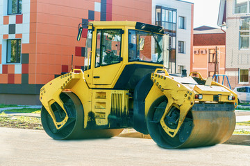 Road roller working at road construction site in the city