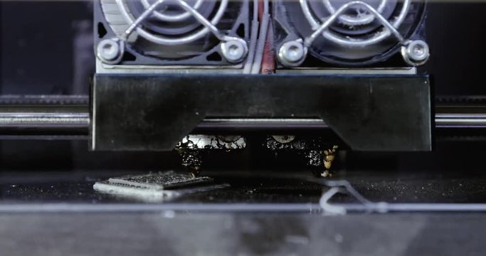 Three dimensional printer during work in school laboratory, 3D plastic printer, 3D printing