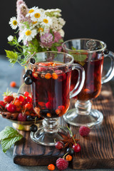 Herbal tea with berries, autumn healthy concept.