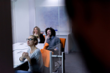 Fototapeta premium Startup Business Team At A Meeting at modern night office building