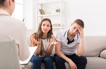Young couple arguing during therapy session