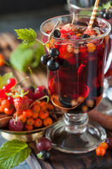 Herbal tea with berries, autumn healthy concept.