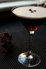 Espresso Martini Cocktail with coffee beans.