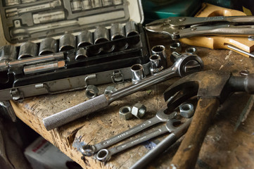 Tools on old workbench - 168081368