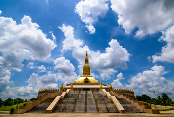 golden Stupa name Mahamongkoljedhi with blue sky and clouds background  in Thailand