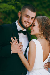 Beautiful bride and groom couple walking at the wedding